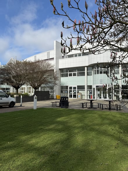 An image of Park Campus as seen from the entrance to the main reception building, with the natural foreground of the campus.