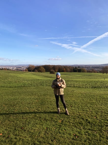Open grassy park overlooking Bristol skyline