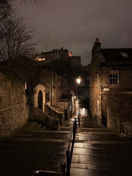 Narrow stone steps leading down in Edinburgh Old Town at night