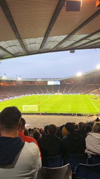 View of a football match at Hampden Park stadium with crowd