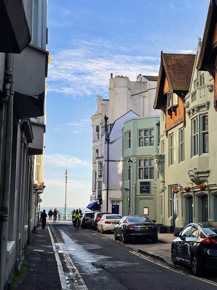 An image of shops and buildings on the coast of Brighton