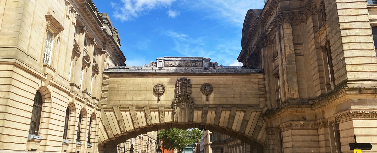 Stone bridge between historic buildings in Paradise Birmingham city centre