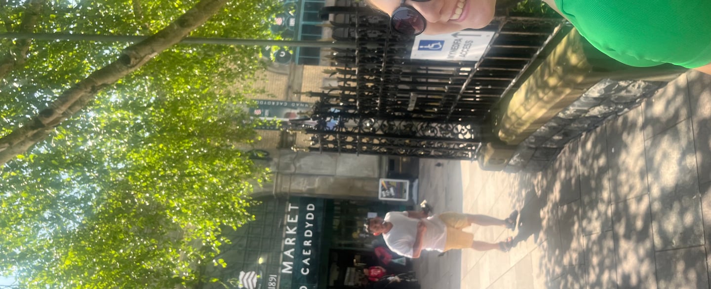 Entrance to Cardiff Market with people walking outside