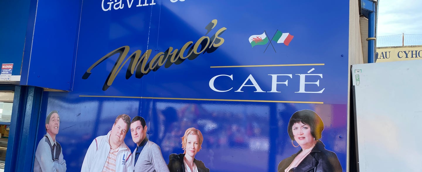 Blue sign for Marco’s Café referencing Gavin and Stacey