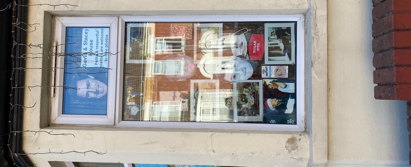 Window display filled with photos and memorabilia