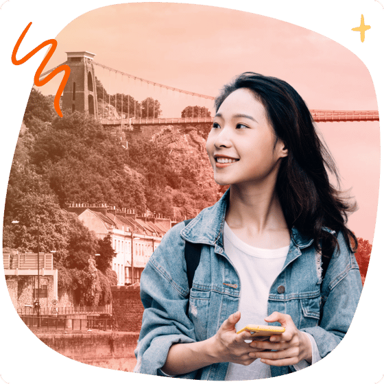 Student with phone in front of Bristol landmarks