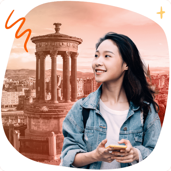 Student with phone in front of Edinburgh landmarks