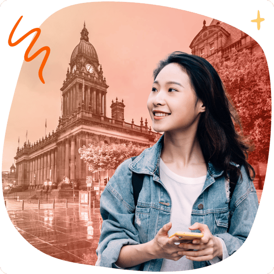 Student with phone in front of Leeds landmarks