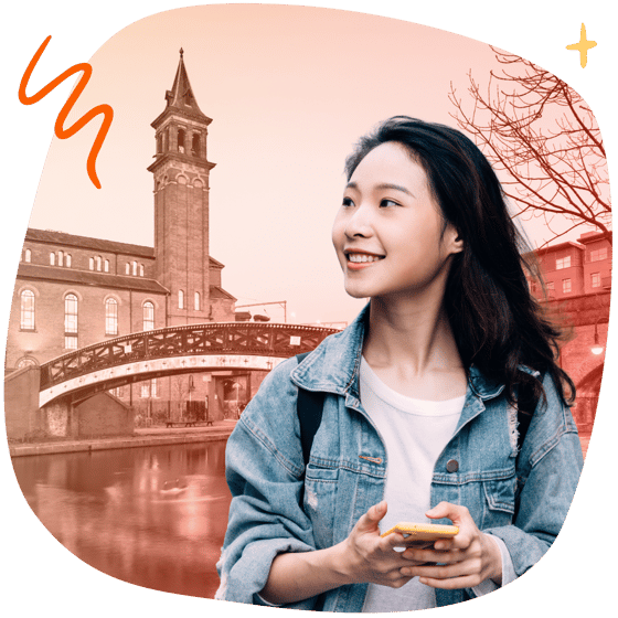 Student with phone in front of Manchester landmarks