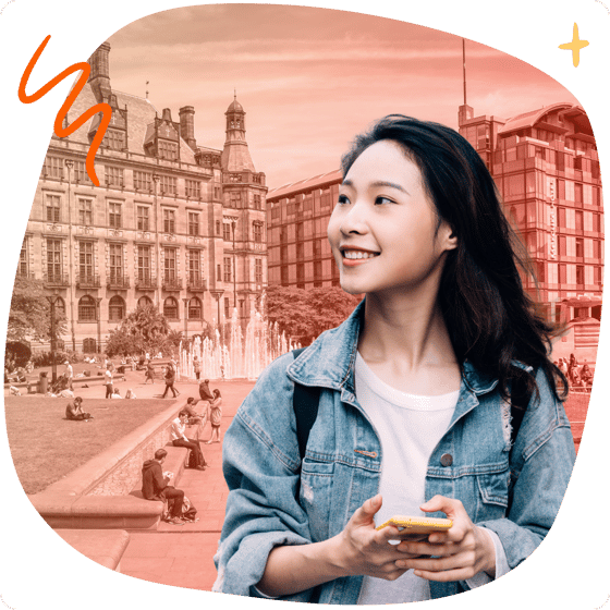 Student with phone in front of Sheffield landmarks