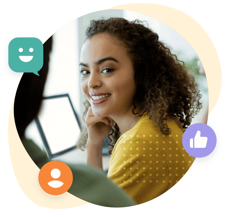 A woman wearing a headset is smiling at the camera